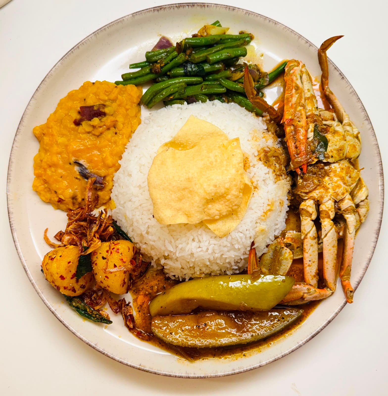 Supplied rice with crab curry photograph.